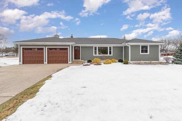 single story home with an attached garage and driveway