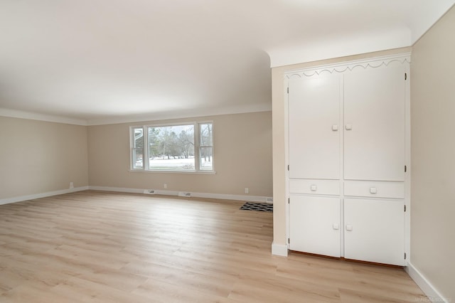 interior space featuring light wood-style floors and baseboards