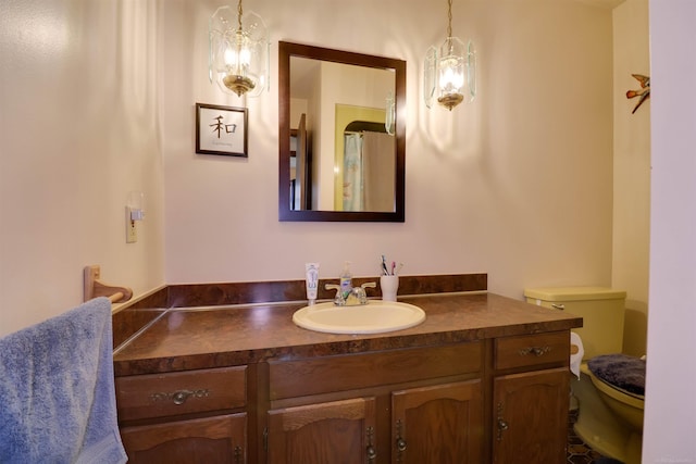 bathroom featuring vanity and toilet