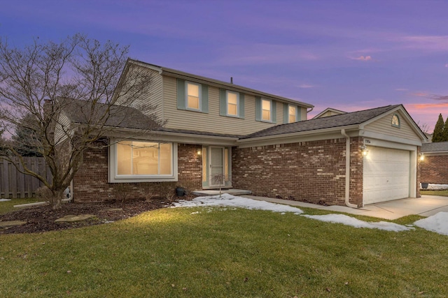 traditional home featuring a garage, brick siding, fence, concrete driveway, and a lawn