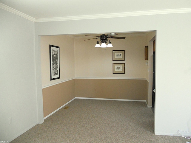 spare room with carpet floors, ceiling fan, baseboards, and ornamental molding