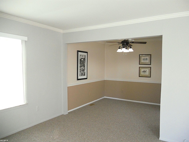 unfurnished room with baseboards, ceiling fan, carpet, and crown molding