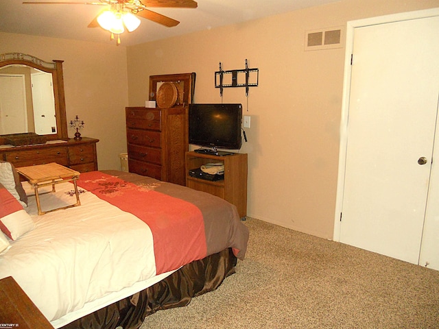 bedroom with ceiling fan, carpet flooring, and visible vents