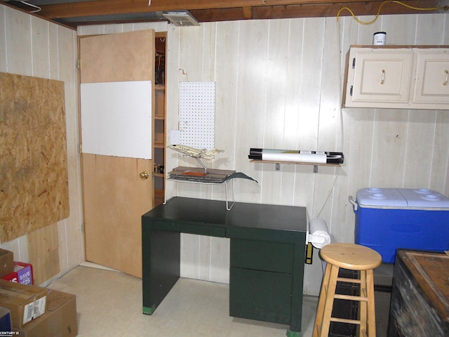 miscellaneous room with wooden walls and light floors