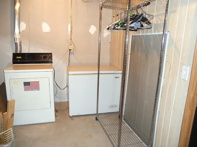 clothes washing area featuring washer / dryer and laundry area