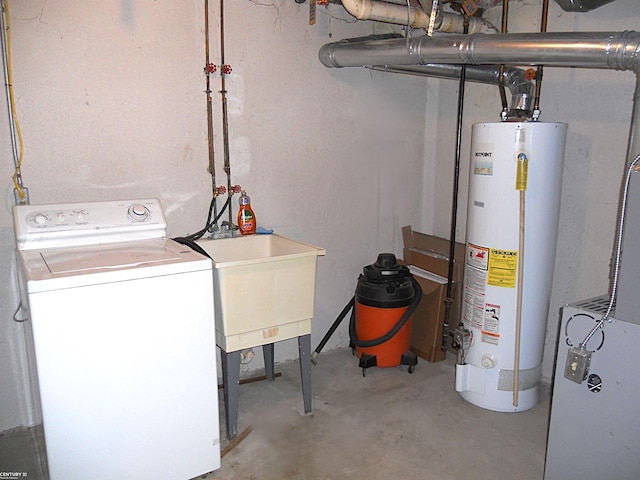 unfinished below grade area with water heater, washer / clothes dryer, and a sink