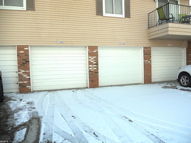 view of snow covered garage