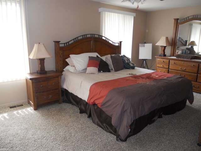 bedroom featuring carpet and visible vents