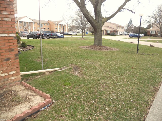 view of yard featuring a residential view