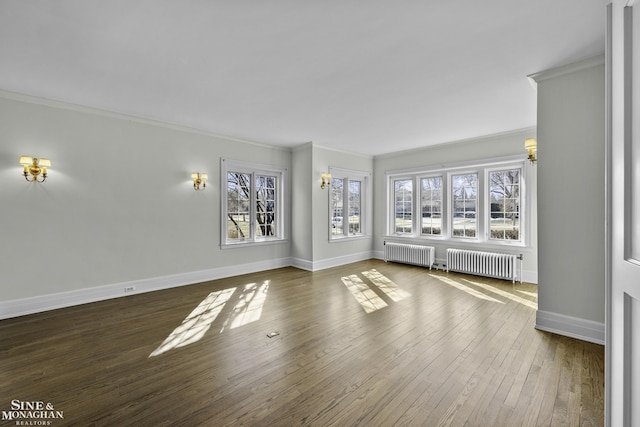 unfurnished living room featuring wood-type flooring, crown molding, and radiator heating unit