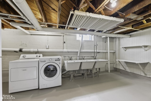 laundry room featuring laundry area and washing machine and clothes dryer