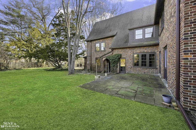 view of yard featuring a patio area and fence