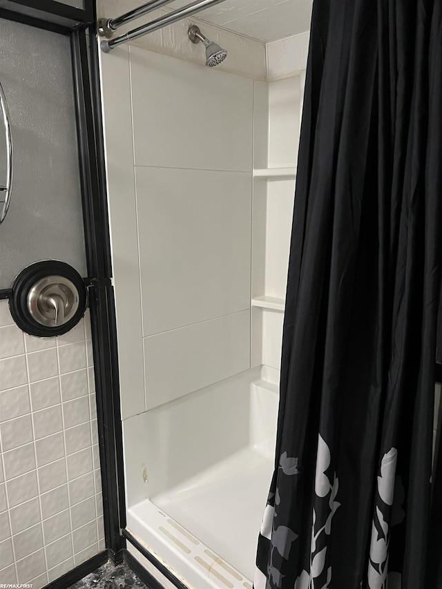 bathroom featuring a stall shower