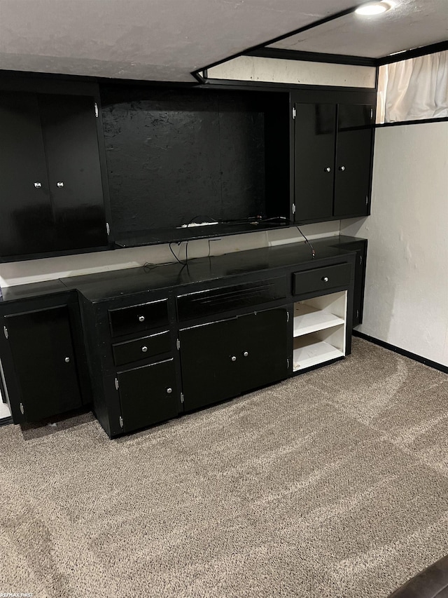 interior space with carpet floors and baseboards