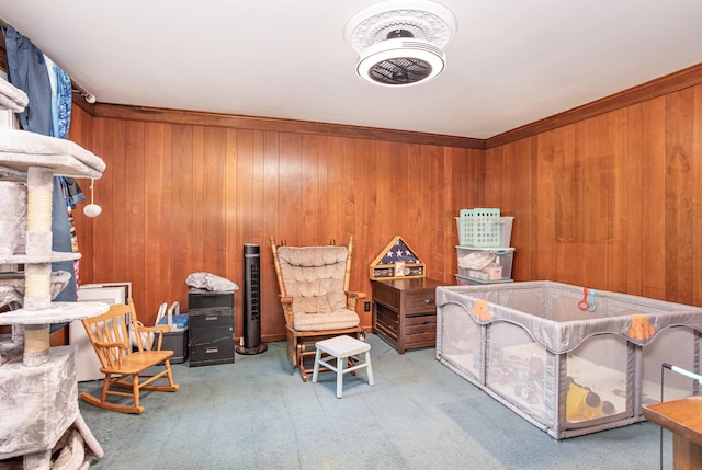 interior space with carpet and wood walls