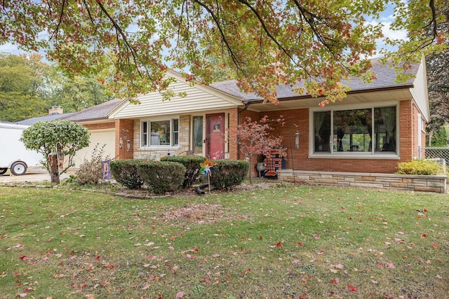 ranch-style home with a garage, brick siding, driveway, and a front lawn