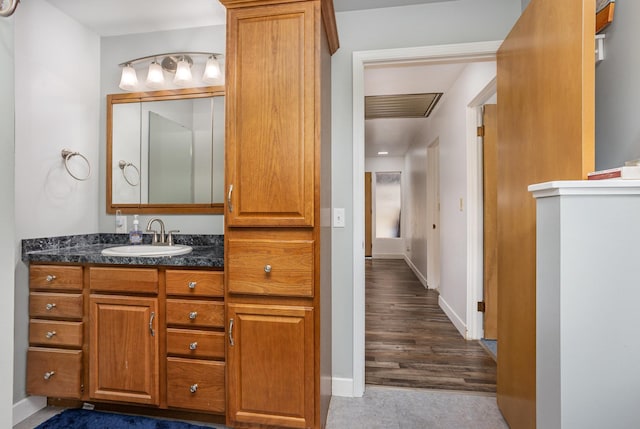 bathroom featuring vanity and baseboards