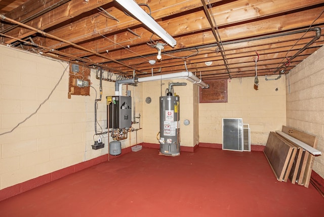 unfinished basement with gas water heater and water heater