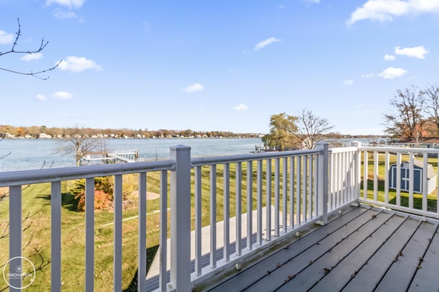 wooden deck featuring a water view