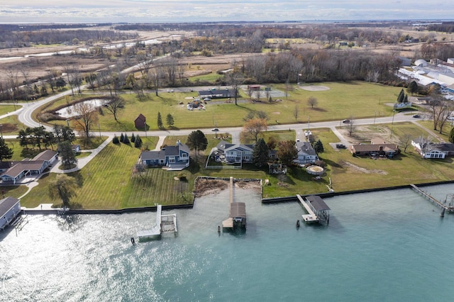 drone / aerial view featuring a water view and a residential view