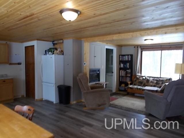 living room featuring wood ceiling and wood finished floors