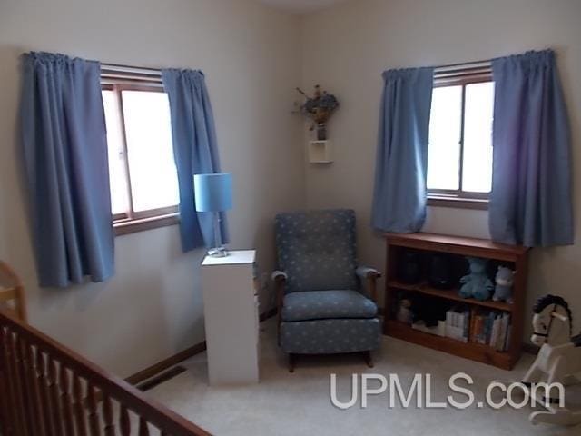 sitting room featuring visible vents