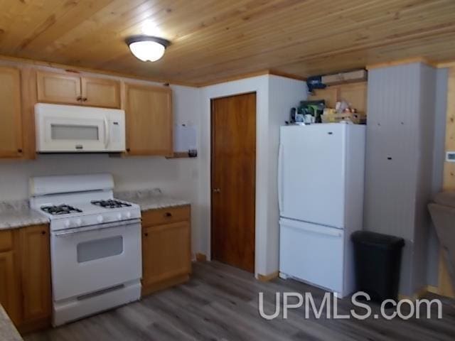 kitchen with light countertops, white appliances, wooden ceiling, and wood finished floors