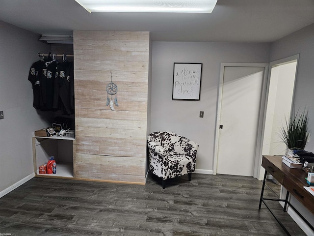 interior space with dark wood-style flooring and baseboards