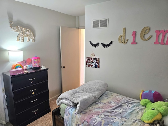 bedroom featuring carpet floors and visible vents