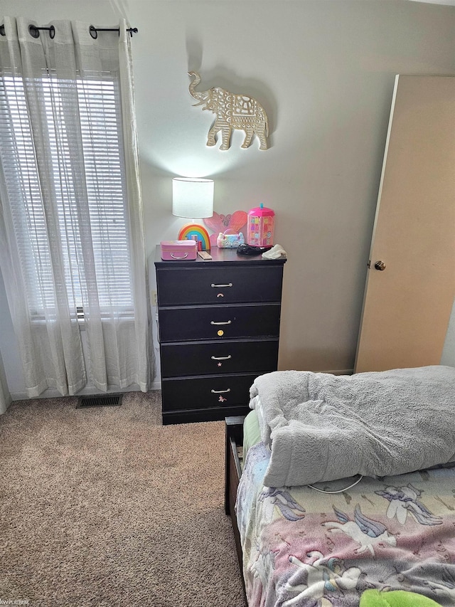 bedroom with carpet flooring and visible vents