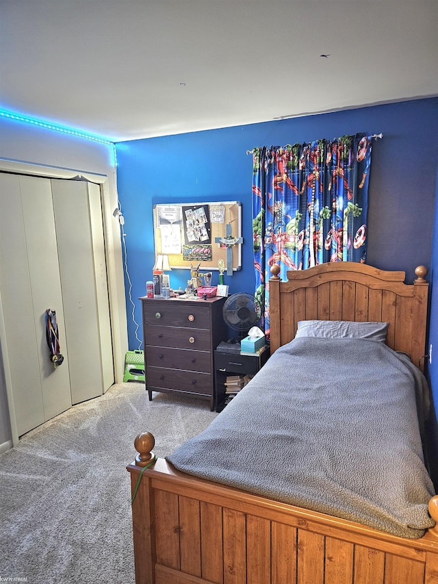 carpeted bedroom featuring a closet