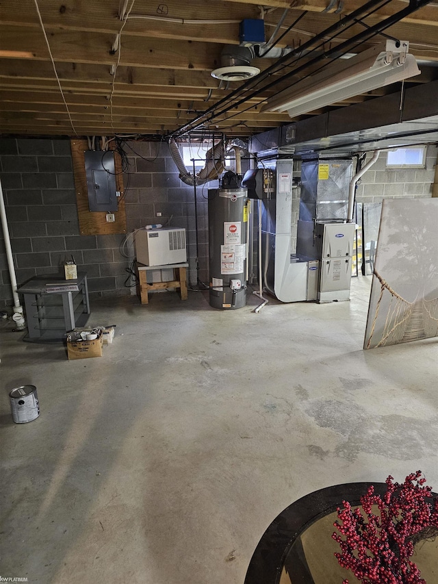 unfinished below grade area featuring heating unit, electric panel, and gas water heater