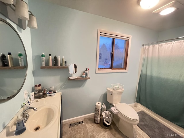 bathroom featuring visible vents, a shower with shower curtain, toilet, vanity, and baseboards