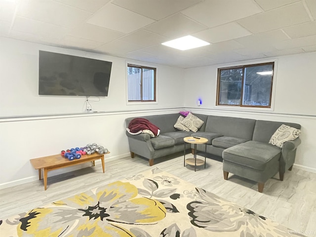 living room with baseboards and wood finished floors