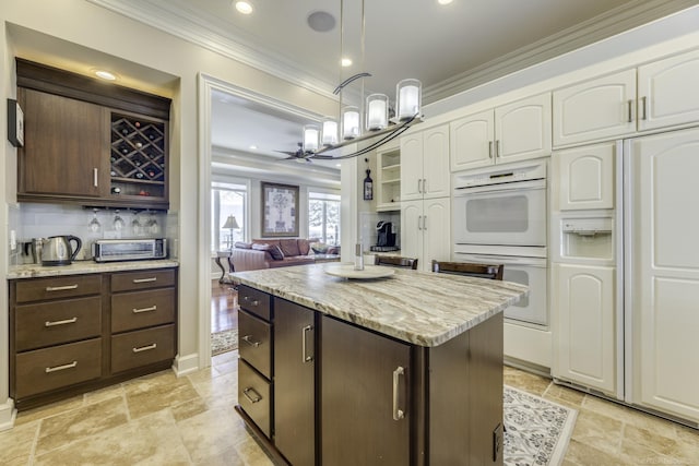 kitchen with white double oven, dark brown cabinets, paneled fridge, white cabinetry, and open shelves