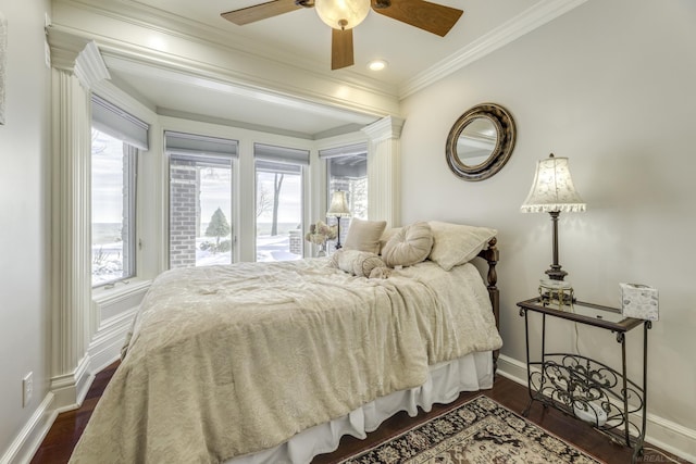 bedroom with dark wood-style flooring, multiple windows, and crown molding