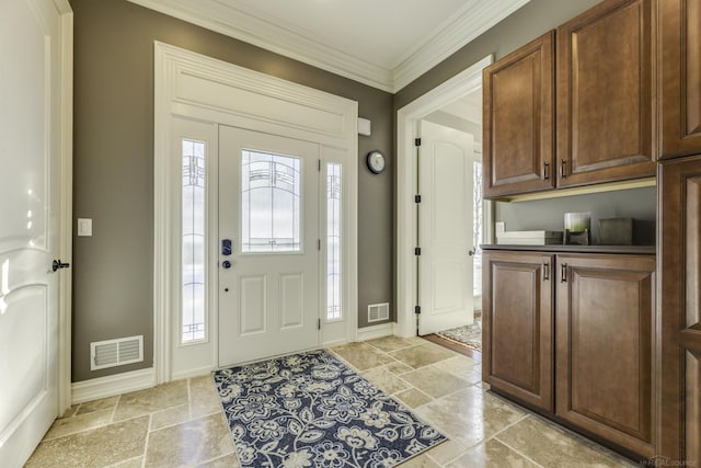 foyer featuring baseboards, stone tile floors, visible vents, and crown molding