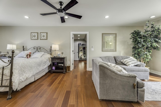 bedroom with ceiling fan, baseboards, dark wood finished floors, and recessed lighting