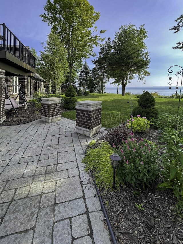 view of patio / terrace featuring a water view