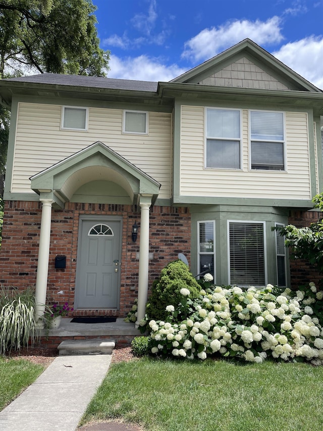 view of front of home with brick siding