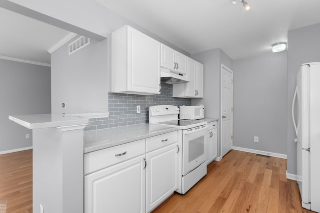 kitchen featuring light countertops, white appliances, backsplash, and under cabinet range hood