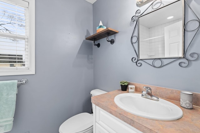 bathroom with toilet and vanity