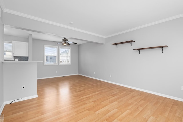 unfurnished room with light wood-style floors, baseboards, a ceiling fan, and ornamental molding