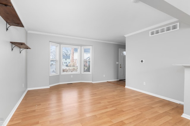 unfurnished living room featuring visible vents, crown molding, light wood-style flooring, and baseboards