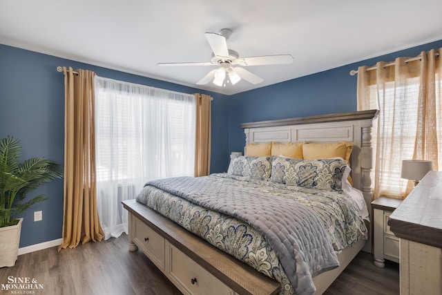 bedroom with a ceiling fan, baseboards, and wood finished floors