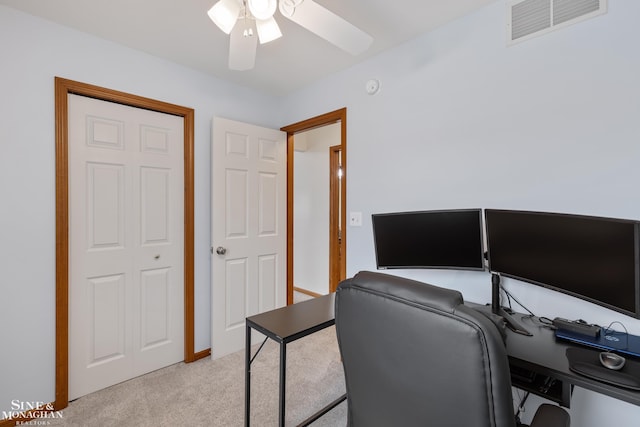 carpeted office featuring ceiling fan and visible vents