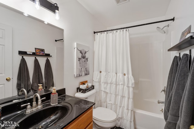 full bathroom featuring toilet, visible vents, shower / bath combo with shower curtain, and vanity