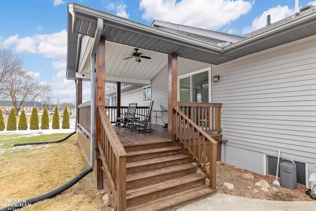 wooden terrace with a ceiling fan