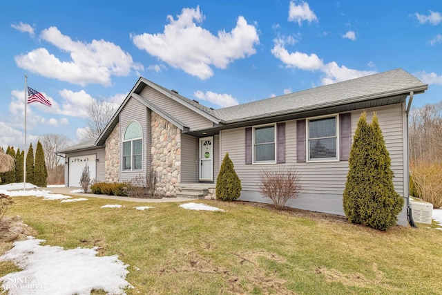 ranch-style home featuring a front lawn, an attached garage, and a shingled roof