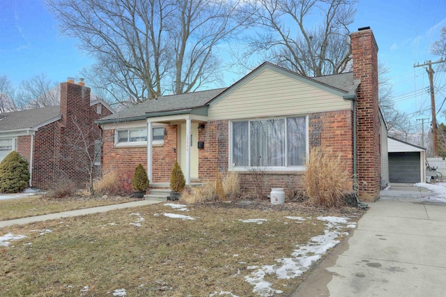 bungalow-style home with brick siding, a chimney, and a shingled roof